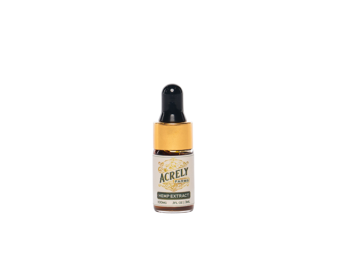 A small amber glass dropper bottle labeled Acrely Farms Hemp Extract, featuring a black dropper cap and a cream label with gold accents, centered on a plain white background.