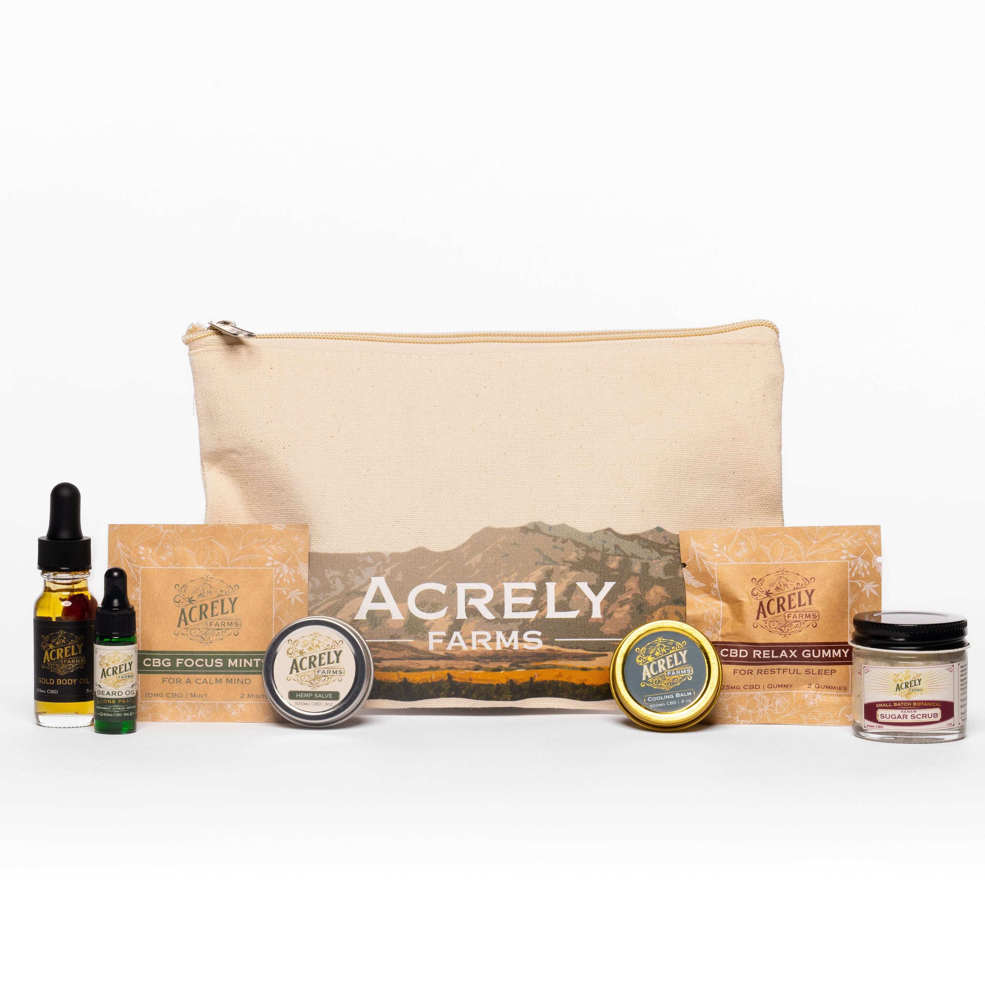 Acrely Farms Adventure Pack Photo contains sample CBD relax gummies, sample CBG focus mints, mini CBD cooling balm, mini CBD hemp salve, mini renew sugar scrub, mini lone peak beard oil, mini CBD gold body oil, and Acrely Farms Canvas Bag