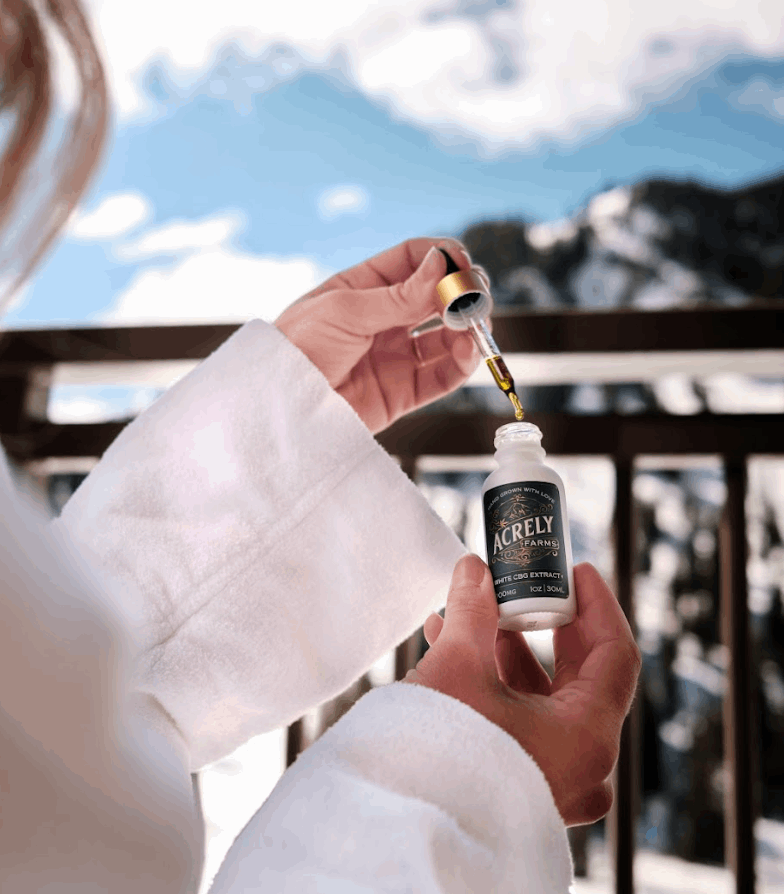 Woman using Acrely Farms 1000mg Organic CBG Extract Tincture for relaxation