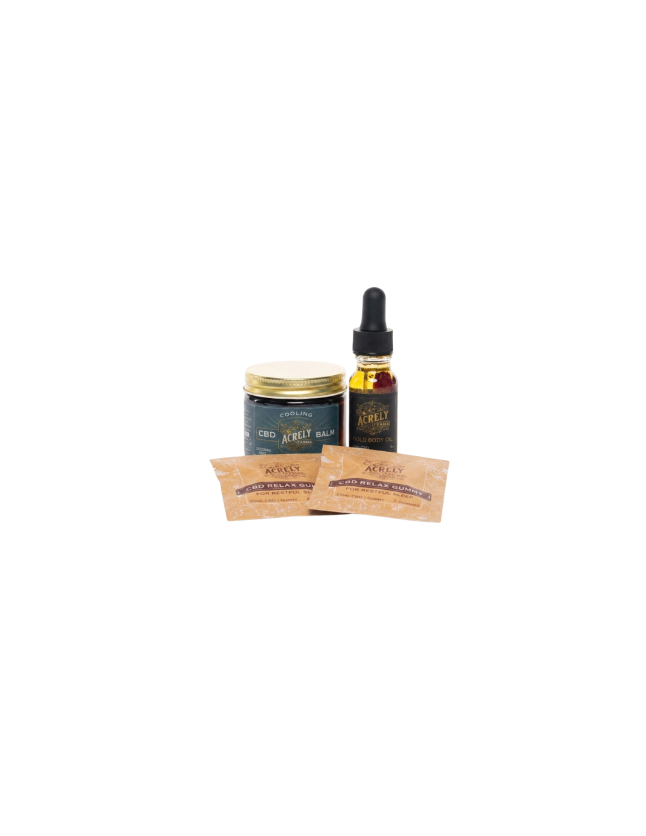 A small product set on a white background featuring a dark blue jar with a gold lid, a dark amber dropper bottle with a black top, and two small tan packets in front.