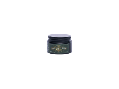A small round black jar with a dark lid and a green label reading &