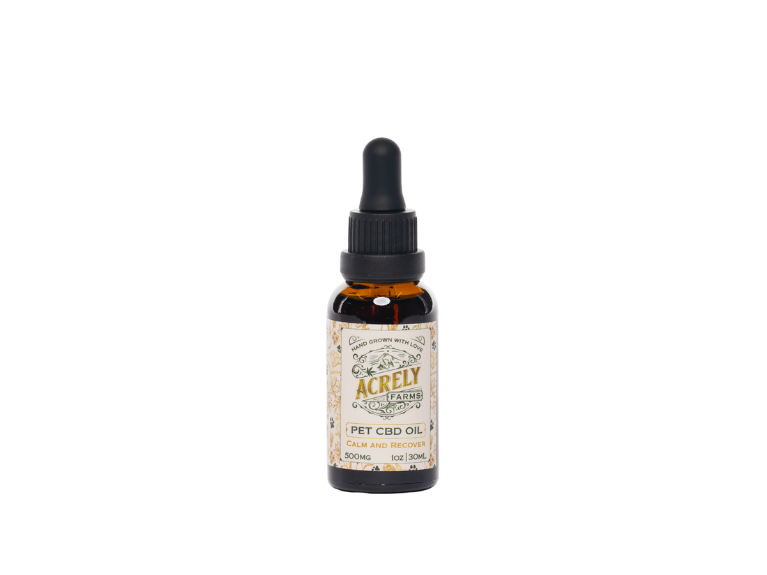 A 1oz amber glass dropper bottle of Acrely Farms CBD Oil for pets, featuring a black dropper cap and a vintage-style cream label with gold and brown text.