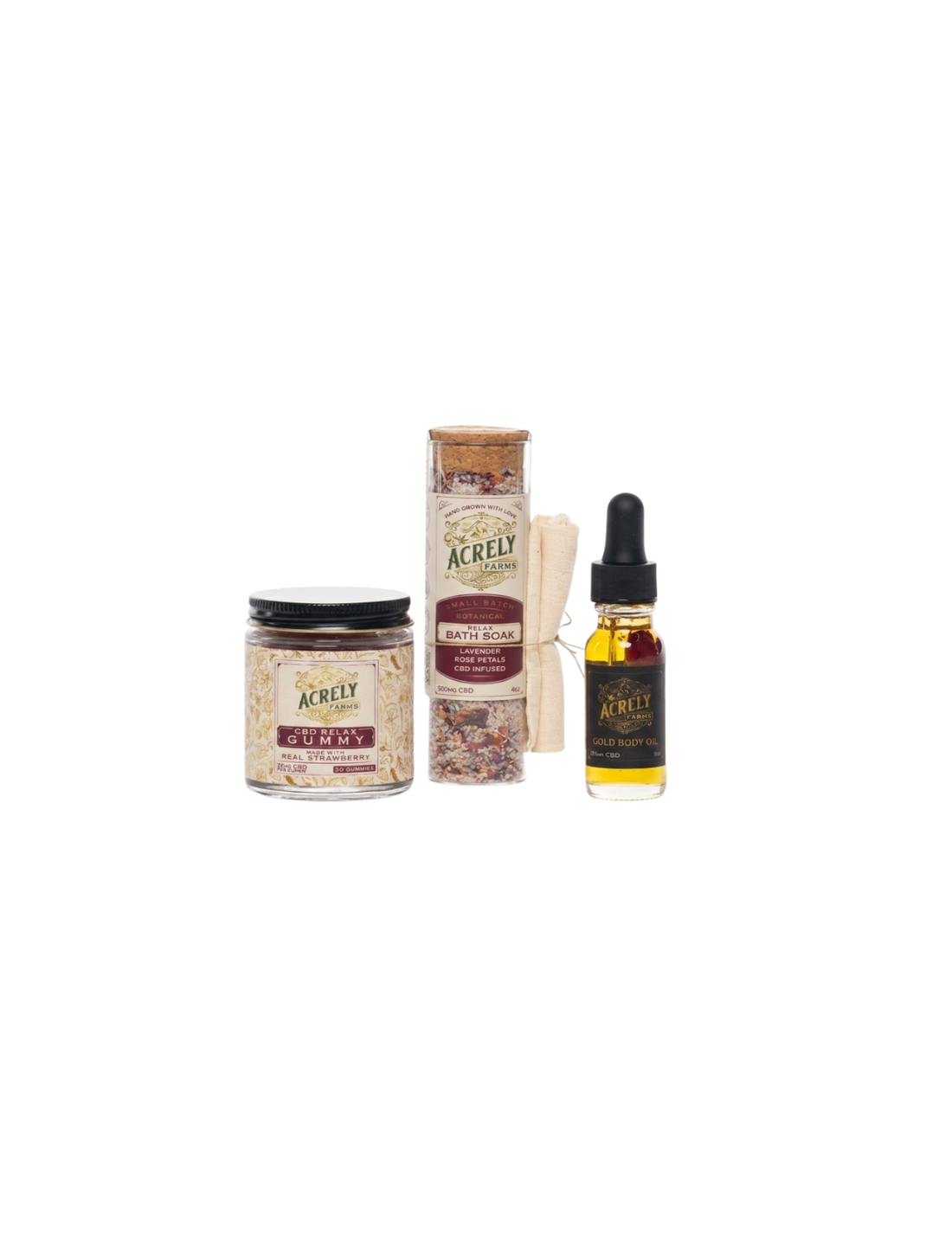 A set of Acrely natural products including a jar of CBD Relax Gummies, a jar of CBD Relax Bath Soak, and a small dropper bottle of Gold CBD Body Oil, arranged on a plain white background.