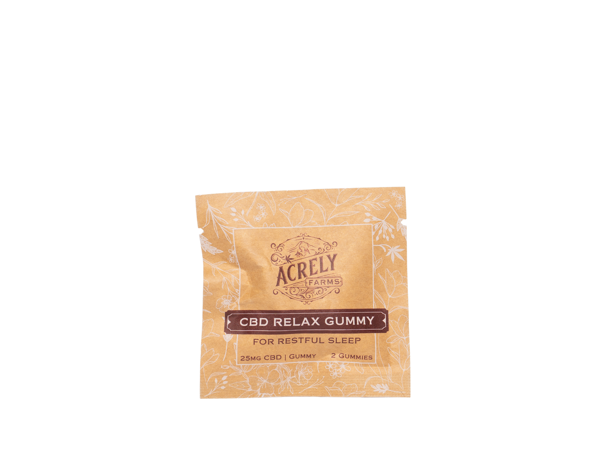 A single packet of Acrely Farms CBD Relax Gummy, featuring a light tan and white patterned wrapper with a dark brown label, isolated on a white background.