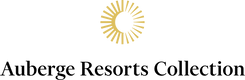 Auberge Resorts Collection logo with a sun design on a green background
