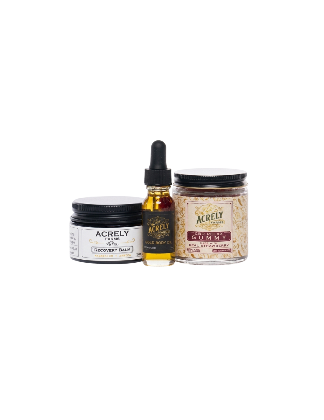 Three Acrely haircare products arranged together on a white background: a black-lidded jar labeled Recovery Balm, a small amber dropper bottle with black cap, and a clear jar containing beige dried botanicals with a black lid and a red label.